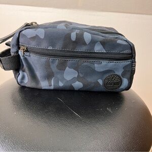 DOPP KIT/BAG with Tree logo on front. Top zip opening & Front zip Pocket